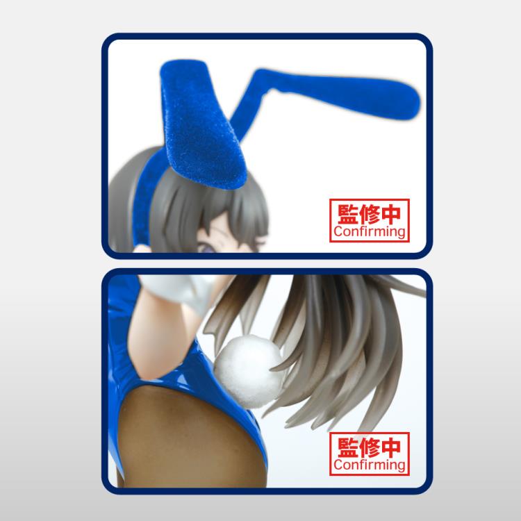 Anime style figure of a character in a bunny outfit with blue hair and white bunny ears, posed on a clear stand.